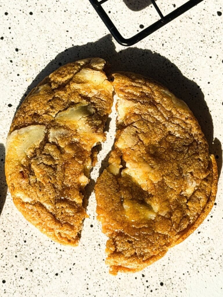 Pumpkin Cheesecake Chunk Cookies are chewy spiced pumpkin cookies loaded with white chocolate cream cheese bark and rolled in cinnamon sugar.